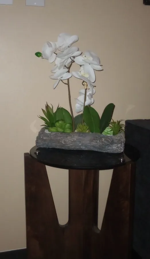 Calm, orchid-accented spa room for facials at Healing Hands